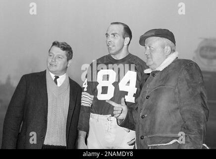 Green Bay Packers' Carroll Dale (84) is pushed and tripped out of