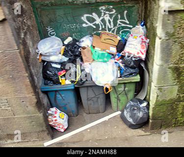 overflowing rubbish bins alley in tunnel  under central station  on midland street Glasgow, Scotland, UK Stock Photo
