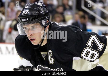 Pittsburgh Penguins' Sidney Crosby prepares to take a face-off in the third  period of an NHL Stadium Series hockey game against the Philadelphia Flyers  at Heinz Field in Pittsburgh, Saturday, Feb. 25