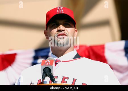 From left to right, Los Angeles Angels owner Arte Moreno, son of Albert  Pujols, Alberto Pujols Jr., owner Carole Moreno, wife of Albert Pujols, Deidre  Pujols, Albert Pujols, C.J. Wilson, general manager