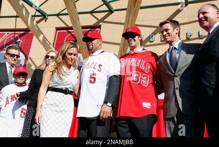 From left to right, Los Angeles Angels owner Arte Moreno, son of Albert  Pujols, Alberto Pujols Jr., owner Carole Moreno, wife of Albert Pujols, Deidre  Pujols, Albert Pujols, C.J. Wilson, general manager