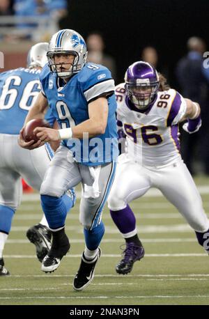 Detroit Lions Matthew Stafford is pursued by San Diego Chargers Vaughn  Martin during the third quarter in Detroit on December 24, 2011. The Lions  beat the Chargers 38-10. With the win the