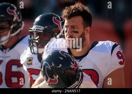 Dec. 11, 2011 - Cincinnati, Ohio, U.S - Cincinnati Bengals quarterback Andy  Dalton (14) being pursued by Houston Texans outside linebacker Connor  Barwin (98) in the NFL football game between the Houston