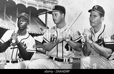 Milwaukee Braves outfielder Hank Aaron, center, jokes with St. Louis  Cardinals players Wally Moon, left, and Stan Musial before start of game  between the Cardinals and the Braves at Busch Stadium in