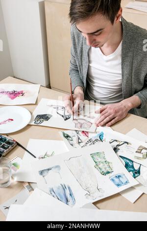 Designer of fashion indusrty works on sketches Stock Photo