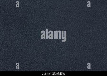 Leather texture on dark blue color. Can be used as background in art or design projects. Stock Photo