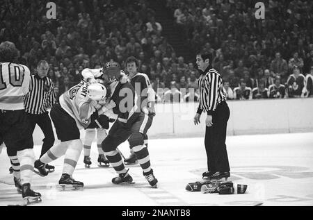 Philadelphia Flyers Andre Dupont (6), left, and Boston Bruins Mike Milbury  (28), right, tangle during a fight in semifinal Stanley Cup hockey play in  Philadelphia on Thursday, April 29, 1976. Both were