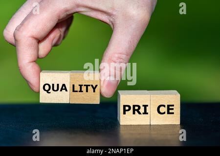 Symbol for selecting a product with a high quality insread of a low price. Wooden cubes form the words quality and price. Stock Photo