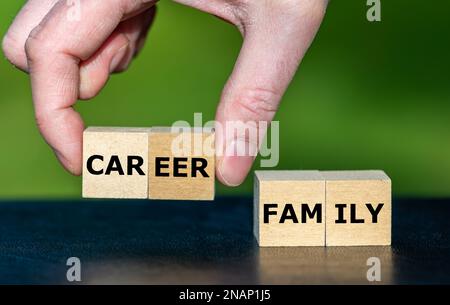 Symbol for choosing against a family and for a career. Wooden cubes form the words career and family. Stock Photo