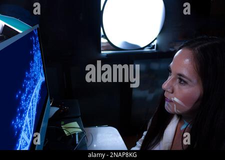 woman doctor works on human dna analysis with computer simulation aids to examine human genetic code in Mexico Stock Photo