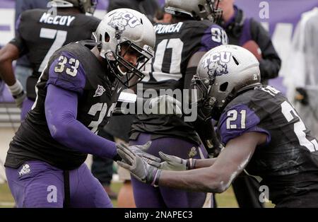 https://l450v.alamy.com/450v/2napec3/tcu-safety-johnny-fobbs-21-congratulates-teammate-linebacker-kris-gardner-33-after-intercepting-a-unlv-pass-and-returning-it-for-a-touchdown-in-the-first-half-of-an-ncaa-college-football-game-saturday-dec-3-2011-in-fort-worth-texas-tcu-won-56-9-apbrandon-wade-2napec3.jpg