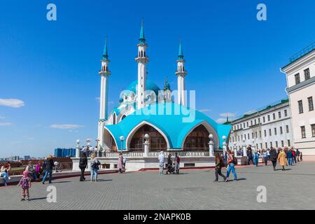 Kazan, Russia - May 7, 2022: Tourists walk the square located in Kazan Kremlin near Kul Sharif Mosque on a sunny day Stock Photo