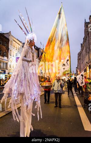 Impersonation of Statue of Liberty with scales of justice, Supporters of WikiLeaks founder Julian Assange hold a 'Night Carnaval' to demand his releas Stock Photo