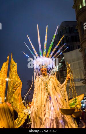 Impersonation of Statue of Liberty with scales of justice, Supporters of WikiLeaks founder Julian Assange hold a 'Night Carnaval' to demand his releas Stock Photo