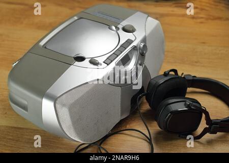 old radio tape recorder with headphones on side panels Stock Photo