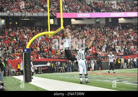 FILE - New Orleans Saints tight end Juwan Johnson (83) attempts to block Cleveland  Browns defensive end Myles Garrett (95) during an NFL football game,  Saturday, Dec. 24, 2022, in Cleveland. As