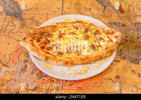 Pide is a type of flatbread typical of the gastronomy of Turkey and Turkish communities outside the country, as well as in some of the countries surro Stock Photo