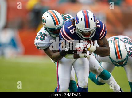 New England Patriots tight end Rob Gronkowski (87) is tripped up by Miami  Dolphins cornerback Will Allen (25) on a 9-yard reception in the fourth  quarter at Gillette Stadium in Foxboro, Massachusetts