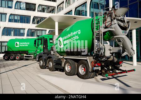 Heidelberg, Germany. 13th Feb, 2023. A company logo of the building materials group 'Heidelberg Materials', formerly 'HeidelbergCement', is attached to a concrete mixer parked in front of the company headquarters. Credit: Uwe Anspach/dpa/Alamy Live News Stock Photo