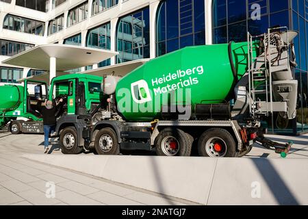 Heidelberg, Germany. 13th Feb, 2023. A company logo of the building materials group 'Heidelberg Materials', formerly 'HeidelbergCement', is attached to a concrete mixer parked in front of the company headquarters. Credit: Uwe Anspach/dpa/Alamy Live News Stock Photo