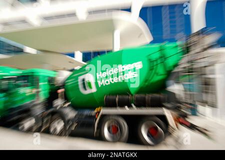 Heidelberg, Germany. 13th Feb, 2023. A company logo of the building materials group 'Heidelberg Materials', formerly 'HeidelbergCement', is attached to a concrete mixer parked in front of the company headquarters. (Photo with zoom effect) Credit: Uwe Anspach/dpa/Alamy Live News Stock Photo