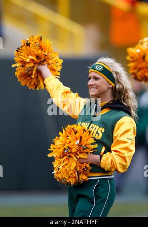 A Green Bay Packers cheerleader is seen before an NFL football