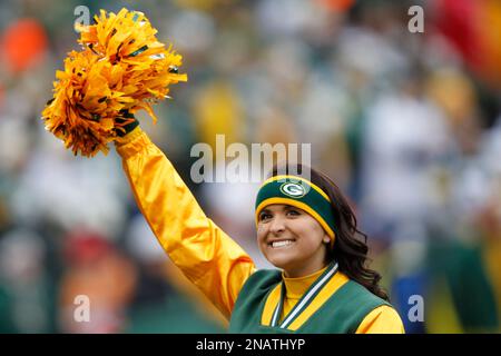 A Green Bay Packers cheerleader is seen before an NFL football