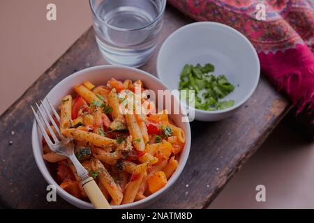 Fish and pasta dish with vegetables shot from above. Stock Photo
