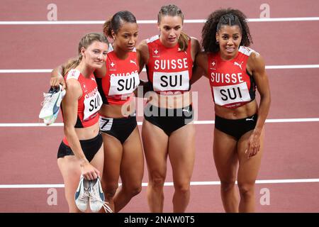 AUG 06, 2021 - Tokyo, Japan: Riccarda Dietsche, Ajla Del Ponte, Mujinga Kambundji and Salomé Kora of Switzerland react to finishing 4th in the Athleti Stock Photo