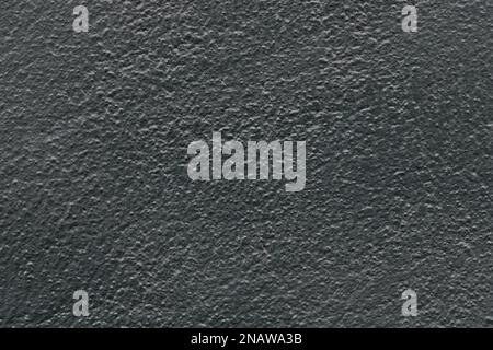 Abstract dark gray painted stone uneven texture, black wall background Stock Photo