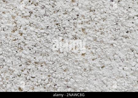 Abstract white uneven bumpy textured wall background, close up Stock Photo