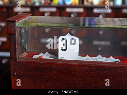 Old fashioned shop till / cash register, pre-decimalisation in the UK, sale recorded of 3d (three old pence) Stock Photo