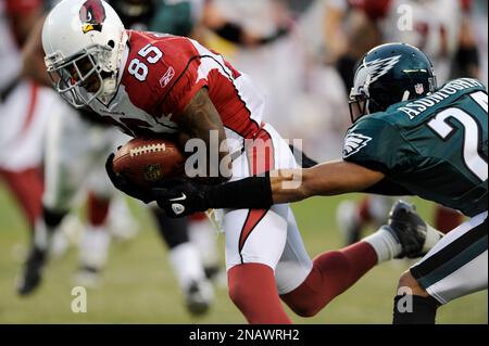 Philadelphia Eagles cornerback Nnamdi Asomugha, left, watches from the  sidelines during the teams NFL football training camp at Lehigh University  in Bethlehem, Pa, Sunday, July 29, 2012. (AP Photo/Rich Schultz Stock Photo  