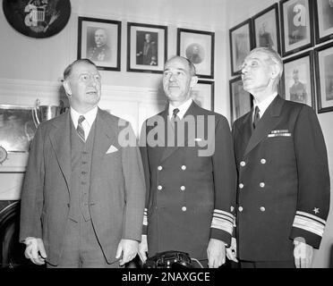 Vice Admiral Russell R. Waesche confers with Rear Admiral Leon Covell