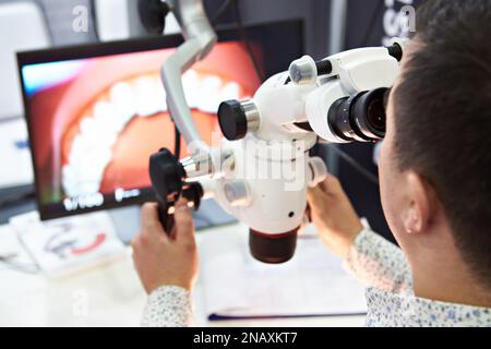 Dental surgery microscope and doctor Stock Photo