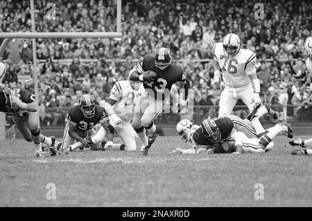 Larry Brown (43), premier runner in the Washington redskins backfield,  usually draws a crowd of opponents when he carries the ball-as in this  scene in the redskins-Green Bay Packers playoff game, Dec.