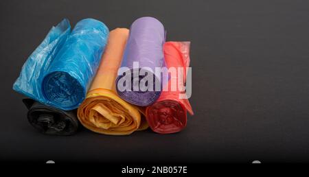Dustbin Polythene colored Bags on a black Stock Photo