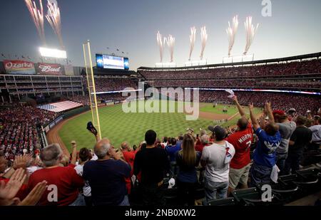 Rangers fans cheer during game 4 of the World Series between the Texas  Rangers and the St. Louis Cardinals at Rangers Ballpark in Arlington, Texas  on October 23, 2011. The Rangers defeated