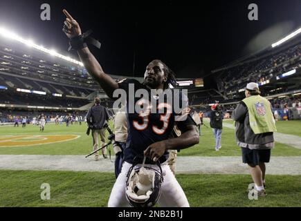 Chicago Bears cornerback Charles Tillman celebrates after returning an  interception for a touchdown duri…