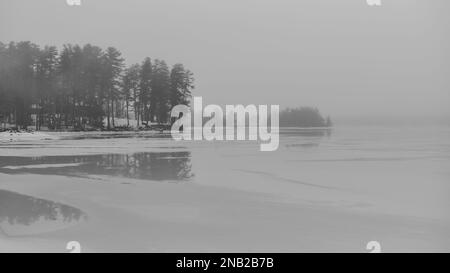 Fog and ice on Cobbosseecontee Lake, Maine Stock Photo