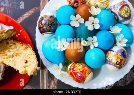 The Feast of Holy Easter. Painted eggs and Easter Kuliches on dishes, top view. Russia, Krasnodar-24.04.2022 Stock Photo