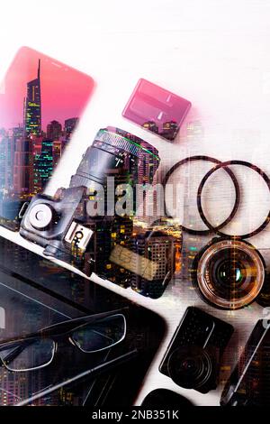 Concept photography background with double exposure. Modern photojournalism and city.Professional Photographic Equipment. Work kit for professional. Stock Photo