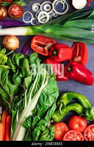 Healthy foods. Vegetables and fruits collection on black cement or stone background. Top view and copy space.Vegetarian food background. Stock Photo