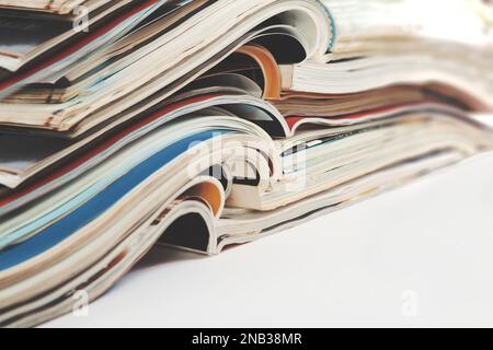 Newspaper and journal. Entertainment and leisure. Publication in magazin and books background.Fashion articles and catalog design over white. Stock Photo