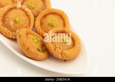 Chandrakala Gujia Mithai Also Called Suryakala Gujiya, Pirukiya, Pirukia, Pedakiya, Karanji, Basundi Gughra Made Of Suji Ghee Stuffed With Mawa Khoya Stock Photo