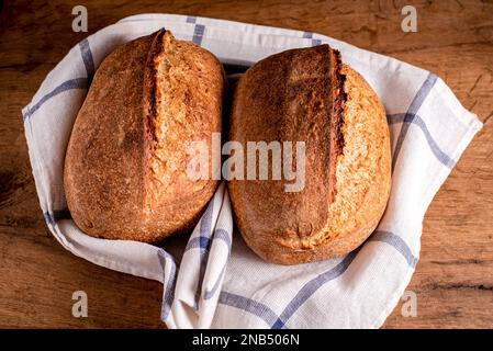 Home baked sourdough breads. Fresh, homemade sourdough breads. Stock Photo