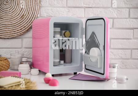 Mini Fridge with Cosmetic Products on Grey Vanity Table Indoors Stock Photo  - Image of cosmetics, lifestyle: 211245636