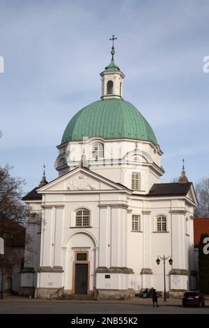 The green domed St. Kazimierz Church, a Roman Catholic church in Warsaw's New Town at Rynek Nowego Miasta Warsaw Poland Stock Photo