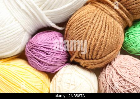 Soft colorful woolen yarns as background, closeup Stock Photo