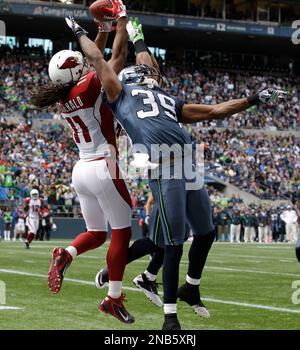 Arizona Cardinals' Larry Fitzgerald in action against the Seattle Seahawks  during an NFL football game, Sunday, Oct. 18, 2009, in Seattle. (AP  Photo/Ted S. Warren Stock Photo - Alamy